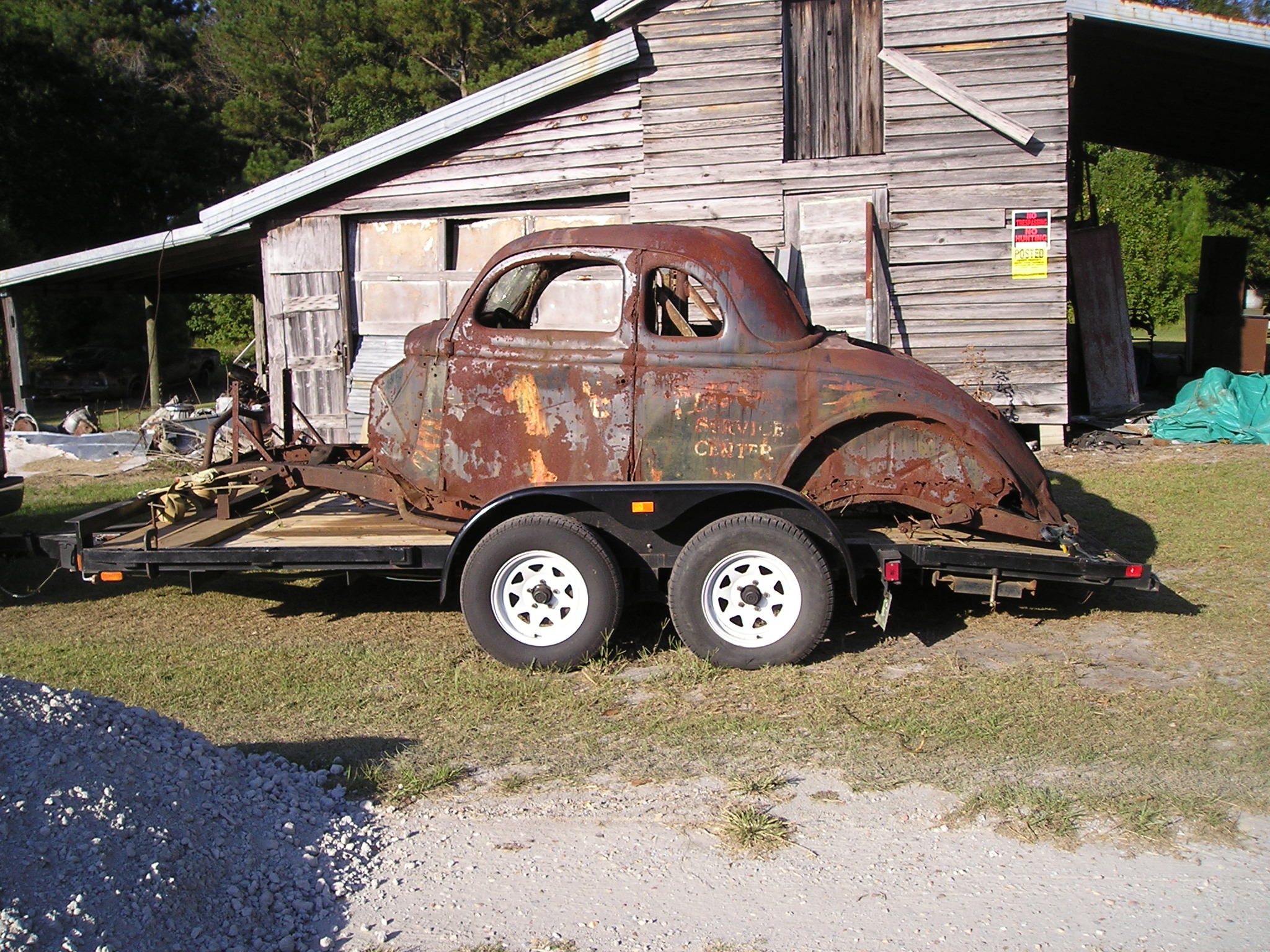 Looking closely, “Pete’s Service Center” comes in to view along with flames and # 1 NC