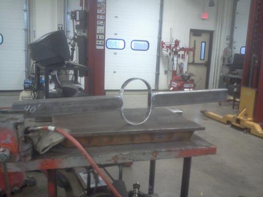 Rear frame brace with loop