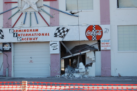 A wrecking ball takes out the ticket booth in the grandstands at BIR on Friday