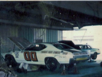 WORKING ON CAR 2-16-1973 BEFORE THE RACE ON 2-17. JESSIE AND RONNIE UNDER THE CAR ~sam &…