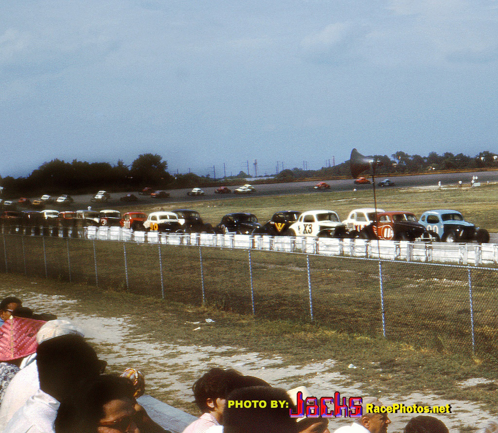 Modifieds coming to the green at Trenton ‘s 1 mile speedway in 1964 to start the 200 Mile…