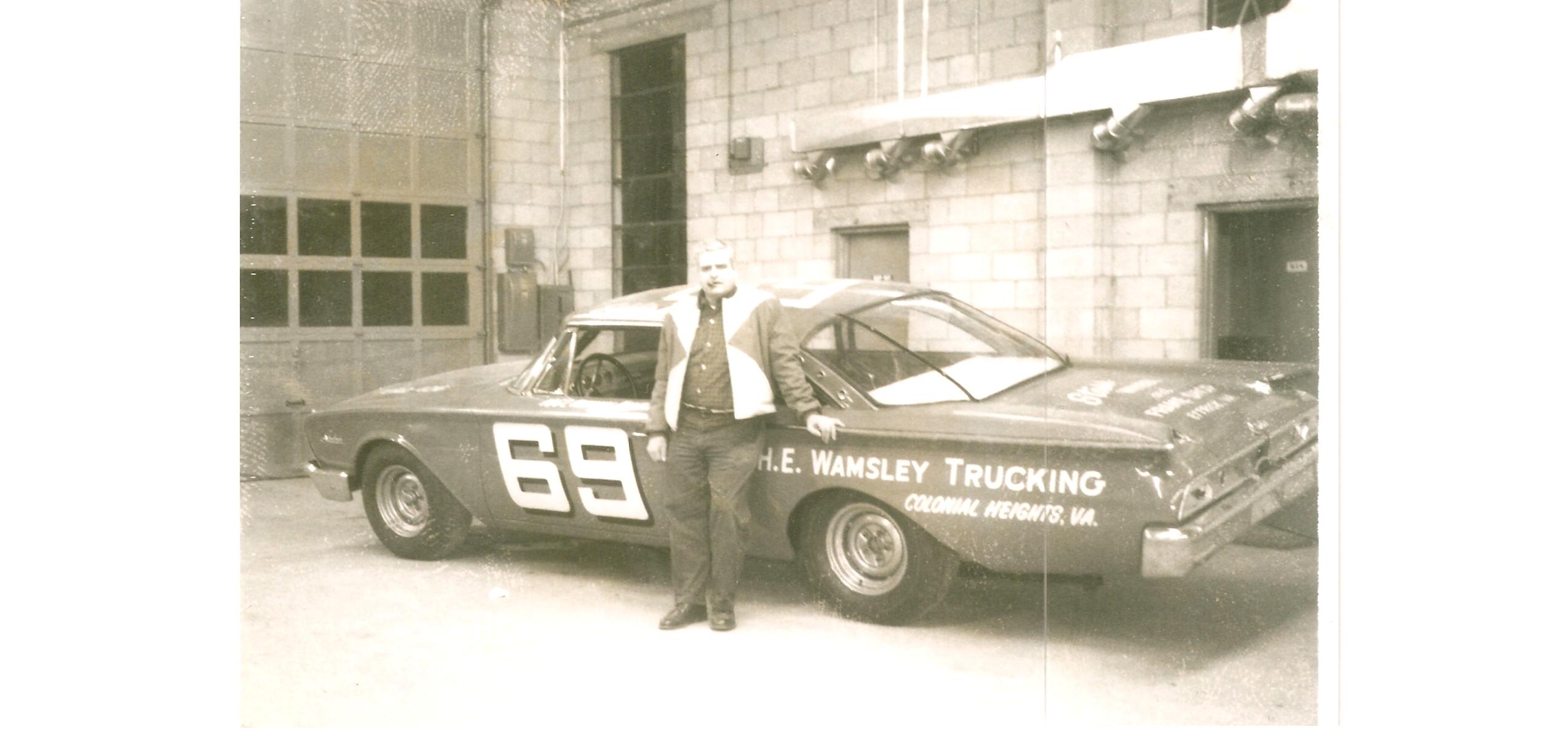1962-3?….. unknown location, guessing at place of business. NOTE.. on the hood, it says…
